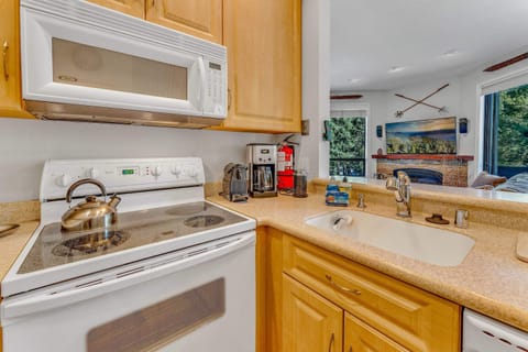 Kitchen: Well-equipped kitchen, range of appliances, spacious counter and cabinets, open layout to living and dining roomKitchen: Well-equipped kitchen, range of appliances, spacious counter and cabinets, open layout to living and dining room