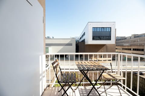 Enjoy fresh air and lovely views from our private balcony, furnished with a cozy seating area, perfect for morning coffee or evening relaxation.