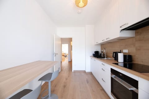 Enjoy cooking in our spacious and modern kitchen, complete with all the essentials and ample counter space for meal preparation.