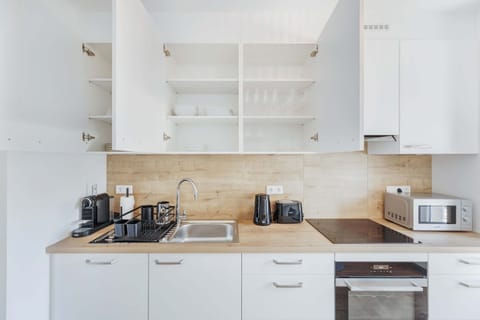 Our fully equipped kitchen features modern appliances, ample storage, and everything you need to prepare delicious meals during your stay.