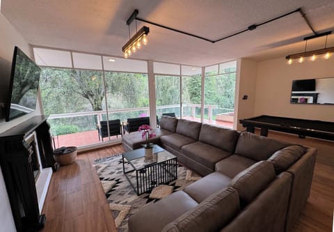 Huge living room for movie night together & direct access to the terrace. There's also a double sofa bed here for two.