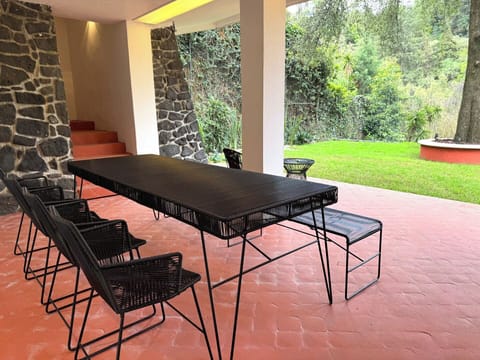 Outdoor dining on the covered patio in front of the big backyard!