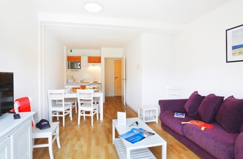 Prepare meals in the kitchenette and enjoy them at the dining table.