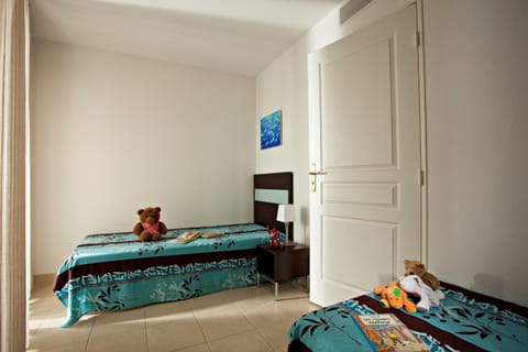 Get a peaceful night sleep in our cozy second bedroom with 2 Single beds.