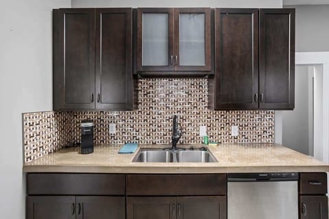 Plenty of plates and dishware for home made meals.