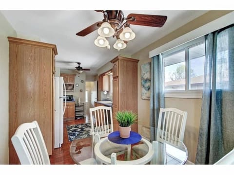 Enjoy your meal in this lovely dining table and chairs with ceiling fun and lots of natural lights.