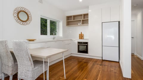 Fridge, oven, dishwasher, dining tables