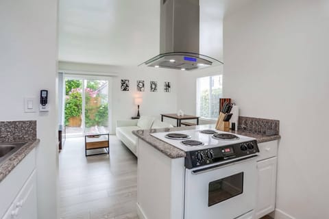Oven has been updated with an open view into the living room