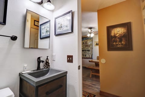 Main floor half bathroom looking out to entryway