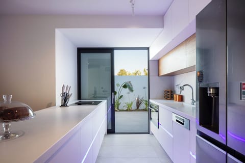 The kitchen is fully equipped with state-of-the-art appliances, ensuring that preparing meals feels like a delightful breeze.