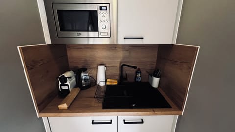 Fridge, microwave, coffee/tea maker, toaster