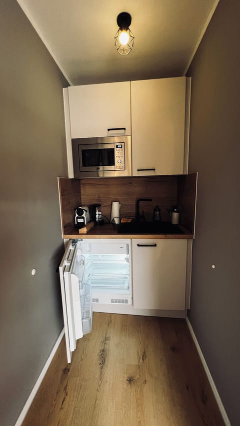 Fridge, microwave, coffee/tea maker, toaster