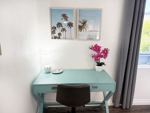 Dedicated workspace with natural light and inspiring beachy decor—great for remote work or planning your day in San Diego.