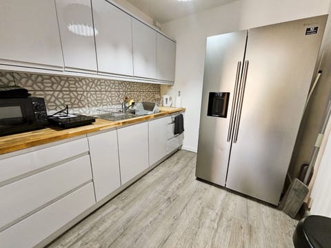 Fridge, microwave, toaster, cookware/dishes/utensils