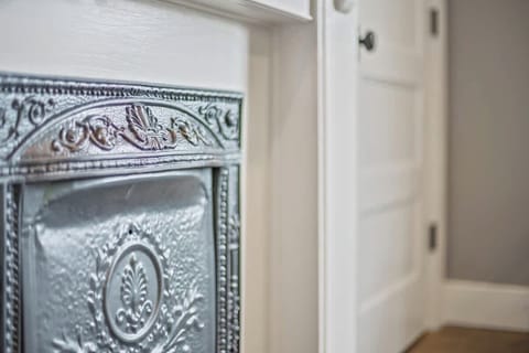 Preserved non-working fireplaces showcase 1920s charm and character in the office space.