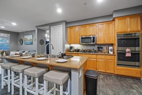 Stylish kitchen island with high chairs, perfect for casual meals.
