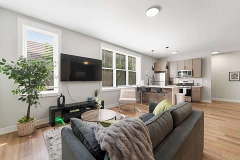 Relax in this bright and modern open-concept space, featuring a cozy living area, fully equipped kitchen, and a stylish dining nook. Designed for comfort and convenience—perfect for unwinding, cooking, and enjoying your stay