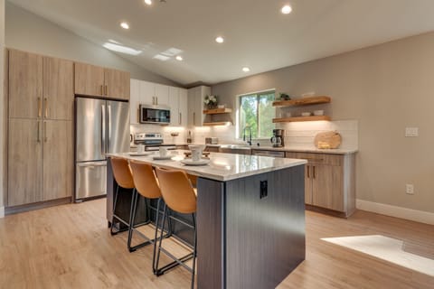 - Modern chef's kitchen with stainless steel - Tahoe cabin rental upgrade
- Spacious island with bar stools - perfect for cooking and gathering
- Bright open layout with natural light - cozy group vacation retreat