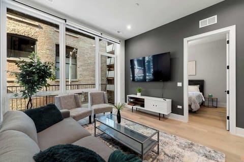 Cozy living room with a large sectional, modern decor, and plenty of natural light