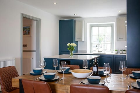 Kitchen dining area with table laid for dinner