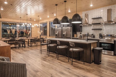 Enjoy stylish countertop seating with a seamless flow to the dining area, offering an open view of the beautifully appointed kitchen.