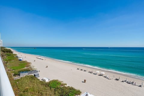 On the beach, sun loungers, beach towels