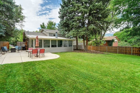 Plenty of grass to let your furry friend run around with fire pit and sun room! *Yard is fully fenced