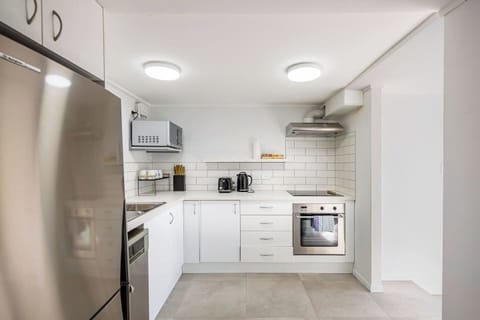 The kitchen has everything you need to create meals including a cook top, oven, microwave, and toaster.