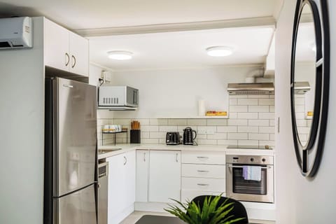 The kitchen is part of the open-plan living spaces with the dining and living rooms.
