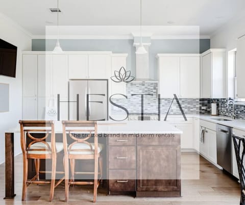 Gourmet kitchen with 5 burner gas stoves will delight any home chef.  Features a bar fridge to keep all your drinks cold.