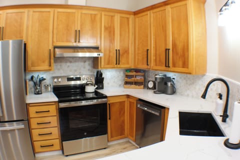 Fully stocked kitchen including all cookware, utensils, and upscale appliances.
