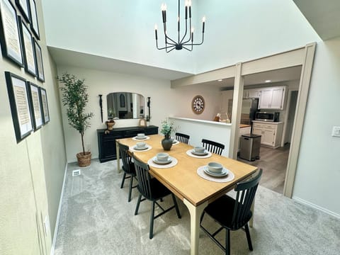 Beautifully lit dining room with tall ceilings, thanks to brand new skylights!