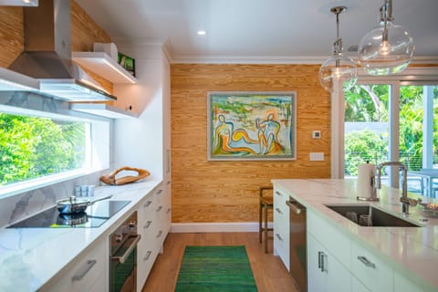 Gourmet kitchen with Keurig coffee machine, lots of cookware, and enough dishes and utensils for everyone