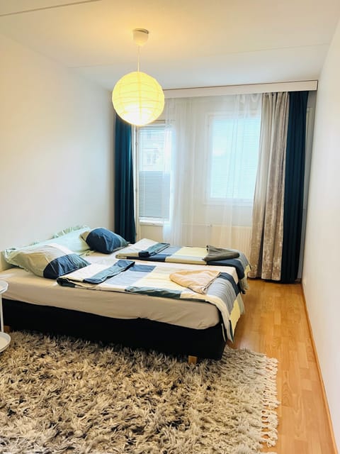 Cozy Helsinki bedroom with comfortable king size bed and soft linens.