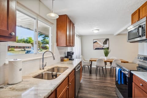 Fully Furnished Kitchen Open to Dining Area