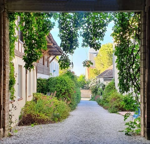 Looking down the courtyard from the barn (parking) to the church of Eclance