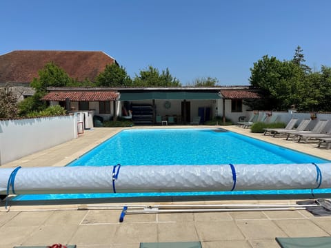 The outdoor heated pool available high season