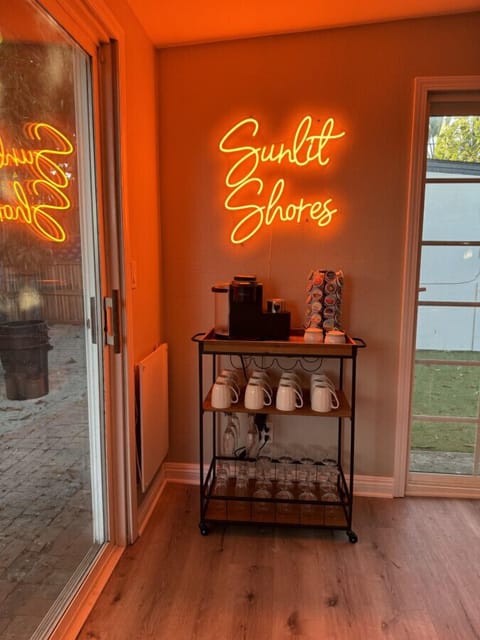 Coffee Corner: Sip your brew while basking in the glow of the playful neon vibe!