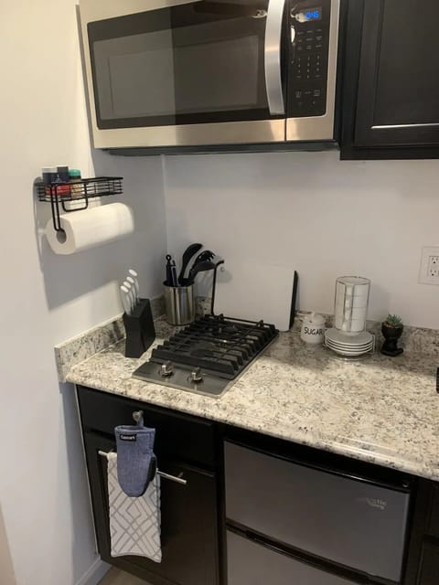 Fridge, microwave, stovetop, coffee/tea maker