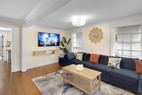 Living room with TV. We provide streaming to Netflix.