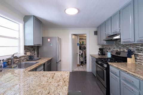 Kitchen and door to laundry/supply room.
