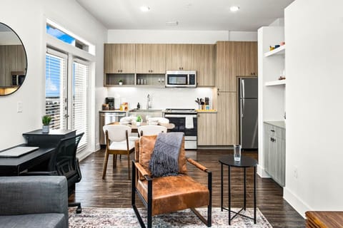 The kitchen’s open layout allows you to move freely as you prepare meals, with everything you need at your fingertips.