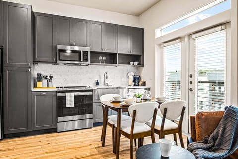 As you open the kitchen, you discover an assortment of coffee pods, and sugar, ensuring you have everything you need for a perfect morning or afternoon pick-me-up.