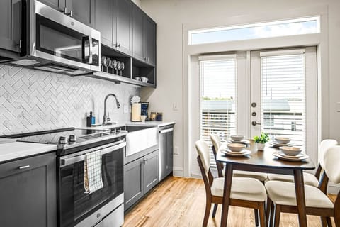 Elegant dining area with a large table and comfortable seating, perfect for gathering with family and friends for a meal.