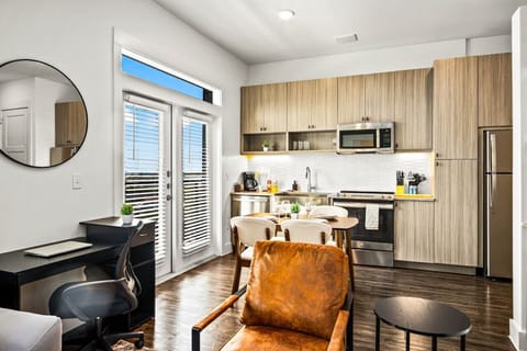 The living room is filled with natural light, creating a bright and welcoming space that invites relaxation.