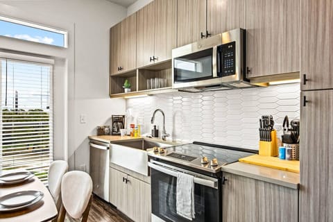 The kitchen invites you to experiment with new recipes, offering a stylish and practical space to cook and create.