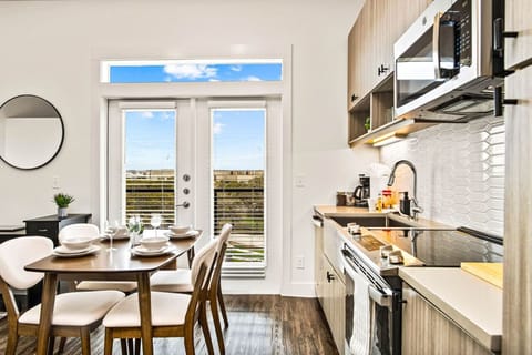 Set the table for memorable meals in this beautifully arranged dining area. With elegant place settings and a charming centerpiece, it's perfect for hosting dinner parties or enjoying family dinners in a cozy and stylish atmosphere.