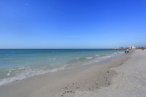 On the beach, sun loungers, beach towels