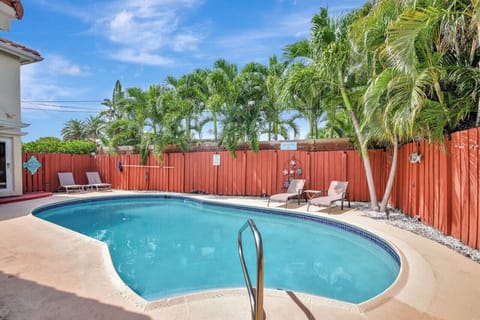 A beautifully designed private heated pool offers a tranquil setting for relaxation.