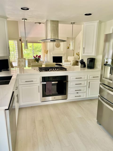 Kitchen with new gas stove top, and oven